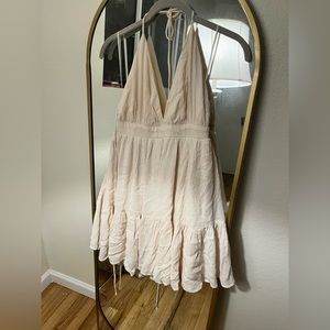 Cream colored short halter top dress.